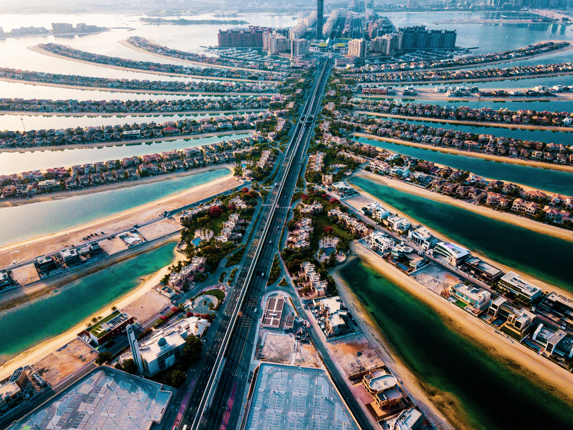 The Palm island with luxury villas and hotels in Dubai aerial view